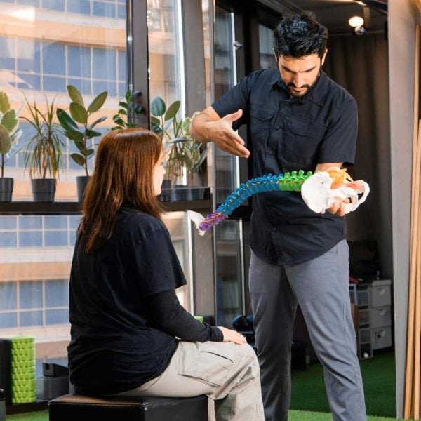 chiropractor-showing-spinal-curve-to-patient